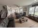 Spacious living room with hardwood floors, fireplace, and a view into the eat-in kitchen at 8011 Caliterra Dr, Charlotte, NC 28227