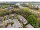 An aerial view of the townhome complex, parking lot, neighboring homes, and highway in the distance at 8230 Rudolph Rd, Charlotte, NC 28216