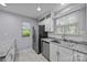 Charming kitchen features stainless appliances, white cabinets, and granite countertops at 8230 Rudolph Rd, Charlotte, NC 28216