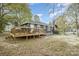 This home has a large wooden deck and spacious yard perfect for entertaining guests at 1013 East Dr, Gastonia, NC 28052