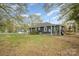 The backyard of this home has a wooden deck and grassy lawn at 1013 East Dr, Gastonia, NC 28052
