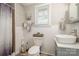 This bathroom features tile walls, wood floors, a white sink, and a shower with a curtain at 1013 East Dr, Gastonia, NC 28052