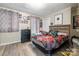 Bedroom featuring neutral walls, wood-look flooring and ample natural light at 1013 East Dr, Gastonia, NC 28052