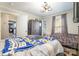 Bedroom featuring two beds, neutral walls, and wood-look flooring at 1013 East Dr, Gastonia, NC 28052