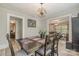 Dining room featuring dark wood furniture, art on the walls, and view to living room at 1013 East Dr, Gastonia, NC 28052