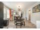 Dining room featuring decorative lighting, light colored walls, and wood flooring at 1013 East Dr, Gastonia, NC 28052