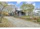 This home's exterior features a driveway and a fenced yard at 1013 East Dr, Gastonia, NC 28052