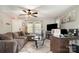 Comfortable living room with a modern ceiling fan and a brown sectional sofa at 1013 East Dr, Gastonia, NC 28052