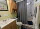 Functional bathroom with a sink vanity, toilet, and shower-tub combo with a curtain at 104 Little River Trl, Fort Mill, SC 29707