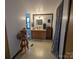 Bathroom with oak vanity, framed mirror, linoleum flooring, and decorative accents at 104 Little River Trl, Fort Mill, SC 29707