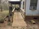 Exterior ramp to access back porch, offering convenience and accessibility to the property at 104 Little River Trl, Fort Mill, SC 29707