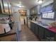 Functional kitchen with gray cabinets, essential appliances, and convenient in-unit laundry access at 104 Little River Trl, Fort Mill, SC 29707