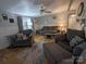 Relaxing living room with ample seating, soft lighting, and stylish decor at 104 Little River Trl, Fort Mill, SC 29707