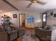 Comfortable living room featuring cozy armchairs, a TV, and access to other rooms at 104 Little River Trl, Fort Mill, SC 29707