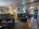 Cozy living room with plush sofas, a fireplace, and an open view into the dining area at 104 Little River Trl, Fort Mill, SC 29707
