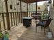 Relaxing porch area featuring comfortable seating, a fire pit table, and a tranquil view of the outdoors at 104 Little River Trl, Fort Mill, SC 29707