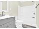 A bathroom features a shower, tub, and gray vanity with brushed hardware at 109 Broad St, Shelby, NC 28152