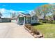 Charming, light green home featuring a welcoming front porch and well-manicured lawn at 109 Broad St, Shelby, NC 28152