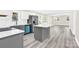 Updated kitchen with stainless steel appliances, white cabinets, and gray island with white countertop at 109 Broad St, Shelby, NC 28152