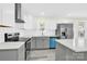Modern kitchen featuring stainless steel appliances, white cabinets, and a subway tile backsplash at 109 Broad St, Shelby, NC 28152