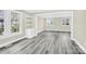 Spacious living room with gray flooring, open layout, and many windows at 109 Broad St, Shelby, NC 28152