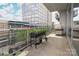 Condo balcony offers ample space for relaxing and entertaining with room for outdoor living at 1100 Metropolitan Ave # 314, Charlotte, NC 28204