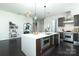 Modern open-concept kitchen with island and stainless steel appliances provides an elegant space at 1100 Metropolitan Ave # 314, Charlotte, NC 28204