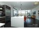 A kitchen with a modern island, stainless steel appliances, and lots of natural light at 1100 Metropolitan Ave # 314, Charlotte, NC 28204
