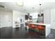 Modern open-concept kitchen with sleek cabinetry, an island with bar seating and stainless steel appliances at 1100 Metropolitan Ave # 314, Charlotte, NC 28204