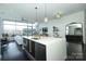 Stylish open-concept living and kitchen with modern island and lots of natural light at 1100 Metropolitan Ave # 314, Charlotte, NC 28204