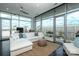 Bright living room with floor-to-ceiling windows and a comfortable white sofa at 1100 Metropolitan Ave # 314, Charlotte, NC 28204