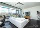 Living room with floor-to-ceiling windows, white sofa, and a view to the outdoor patio at 1100 Metropolitan Ave # 314, Charlotte, NC 28204