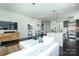 View of the light and bright open-concept living room, featuring a modern kitchen and comfortable living area at 1100 Metropolitan Ave # 314, Charlotte, NC 28204