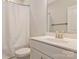 Bathroom featuring white vanity, a white shower curtain, toilet and modern fixtures at 11019 Kilkenny Dr # 41, Charlotte, NC 28277