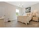 Bedroom with light walls, carpet, and matching bedside tables and lamps at 11019 Kilkenny Dr # 41, Charlotte, NC 28277