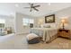 Bright primary bedroom with neutral walls, a ceiling fan and windows for natural light at 11019 Kilkenny Dr # 41, Charlotte, NC 28277