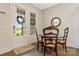 Cozy breakfast nook with French doors, wooden table, and natural light streaming in from the outside at 11019 Kilkenny Dr # 41, Charlotte, NC 28277