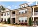 Close up shot of townhomes showcasing a mix of brick and siding with covered balconies at 11019 Kilkenny Dr # 41, Charlotte, NC 28277