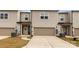 Exterior shot of a two-story house with a two car garage and neutral siding at 11019 Kilkenny Dr # 41, Charlotte, NC 28277