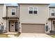 Two-story house featuring a two-car garage, neutral siding, and a sidewalk to the front door at 11019 Kilkenny Dr # 41, Charlotte, NC 28277