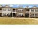 Charming brick and siding townhomes with manicured lawns and covered balconies at 11019 Kilkenny Dr # 41, Charlotte, NC 28277