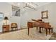 Elegant foyer featuring a grand piano, stylish lighting, and a staircase leading to the second floor at 11019 Kilkenny Dr # 41, Charlotte, NC 28277