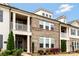 Charming brick townhome with landscaped front yard, covered porch, and ample natural light streaming through the windows at 11019 Kilkenny Dr # 41, Charlotte, NC 28277