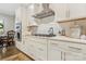 Close-up of modern kitchen featuring stainless appliances, white cabinets, and ample counter space at 11019 Kilkenny Dr # 41, Charlotte, NC 28277