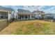 Spacious backyard features a covered patio, with beautiful landscaping and a serene outdoor setting at 11036 Shreveport Dr, Huntersville, NC 28078