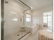 Bright bathroom featuring a glass-enclosed shower and a separate soaking tub, creating a spa-like atmosphere at 11036 Shreveport Dr, Huntersville, NC 28078