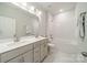 Pristine bathroom features a dual-sink vanity, a tub-shower combo, and sleek fixtures at 11036 Shreveport Dr, Huntersville, NC 28078