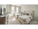 Cozy bedroom highlighting two comfortable beds, soft lighting, and contemporary decor at 11036 Shreveport Dr, Huntersville, NC 28078