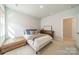 Serene bedroom showcasing a well-made bed, stylish furnishings, and a relaxing ambiance at 11036 Shreveport Dr, Huntersville, NC 28078
