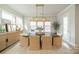 Elegant dining room with natural light, modern decor, hardwood floors, and direct access to the outdoors at 11036 Shreveport Dr, Huntersville, NC 28078